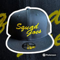 Black and white snapback hat with yellow Squad Goes text for first responders