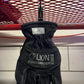 Black work glove hanging from a hook on high-grade metal Glove Clamp, ideal for first responders