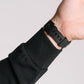 Black wrist watch on Durable Concealment Hoodie with hand pocket and smooth draws