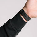 Black wrist watch on Durable Concealment Hoodie with hand pocket and smooth draws