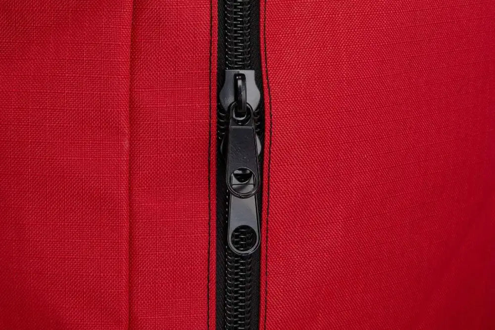 Black zipper detail on red firefighter turnout gear bag with water resistant outer fabric