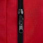 Black zipper detail on red fabric of Deluxe Step-In Firefighter Gear Bag