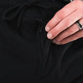 Black zippered pocket pants with carrier retention waistband, ideal for Traveler Joggers and concealed carry