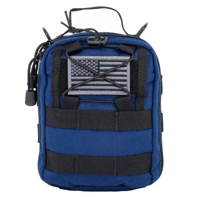 Blue and black MOLLE trauma bag with American flag patch for emergency medical supplies