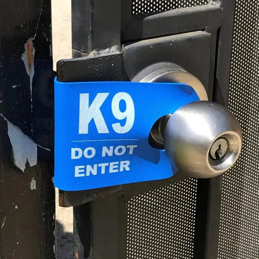 Blue K9 DO NOT ENTER warning sign on door handle for first responders and firefighters