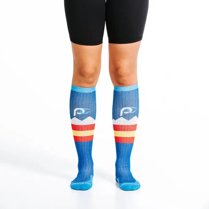 Blue knee-high athletic socks with colorful stripes for Colorado Peaks and first responders