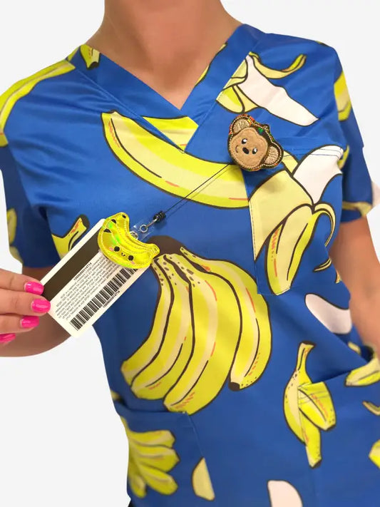 Blue Women’s Gone Bananas Scrub Top featuring yellow banana print for first responders