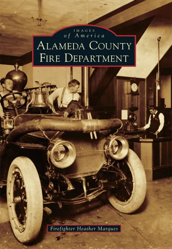 Vintage fire engine with white-walled tires on Alameda County Fire Department book cover