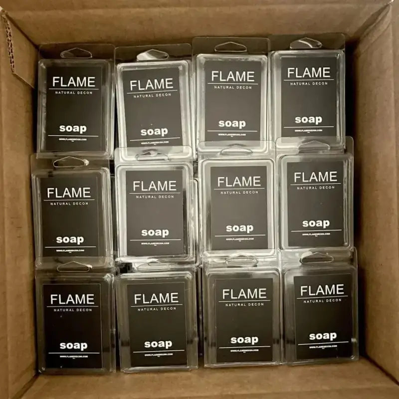 Box of FLAME brand soap bars with activated charcoal and natural ingredients in grid pattern