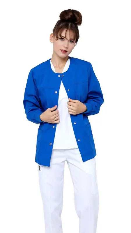 Bright blue women’s snap jacket warm with ribbed sleeves over a white shirt and pants