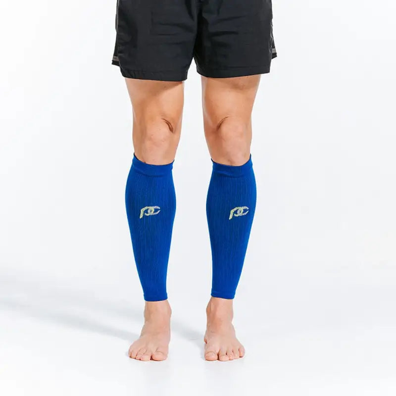 Bright blue compression calf sleeves with rad logos on bare legs for optimal support