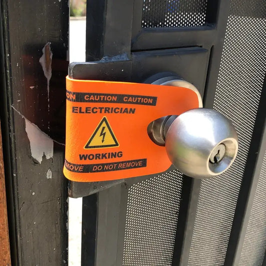 Bright orange Electrician Working sign on door handle for Electrician DoorJamm