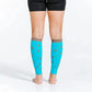 Bright turquoise calf compression sleeves with taupe dots worn on legs