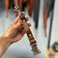 Brown leather firefighter glove strap with metal clasps, ideal for first responders and police