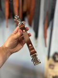 Brown leather firefighter glove strap with metal clasps, ideal for first responders and police