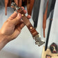Brown leather firefighter police glove strap with metal hardware for quick release and durability