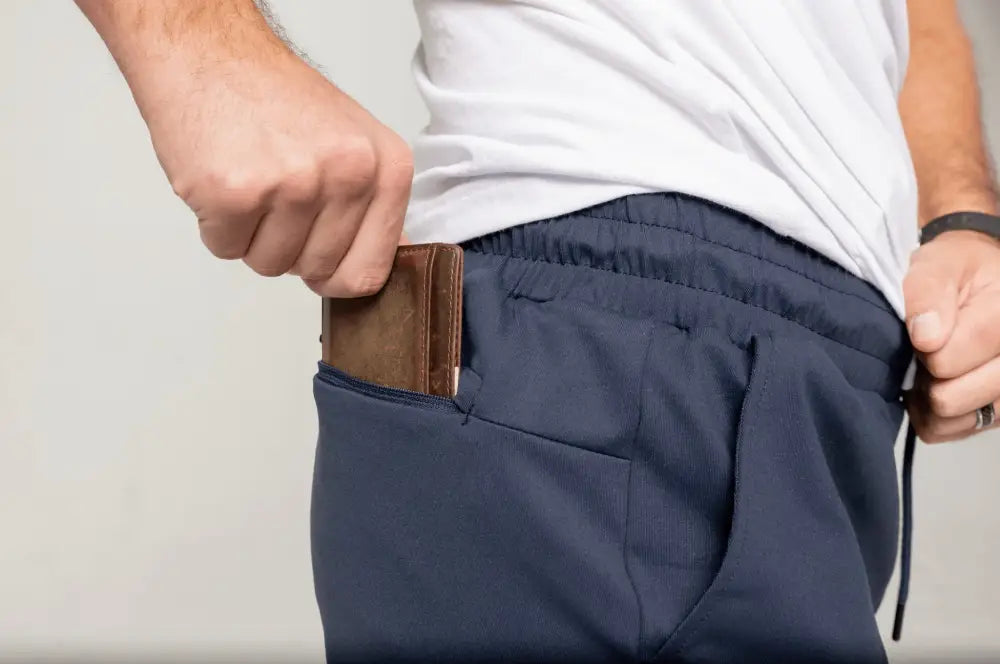 Brown leather wallet in Navy Blue 8’’ Carrier Shorts with patented carrier retention