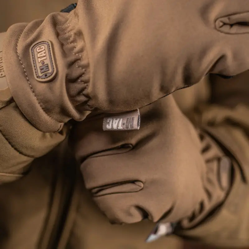 Brown puffy winter jacket showcasing stitching, ideal for M-Tac Gloves Soft Shell Thinsulate