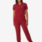 Burgundy women’s tuckable one-pocket scrub top with matching sweatpants and white sneakers