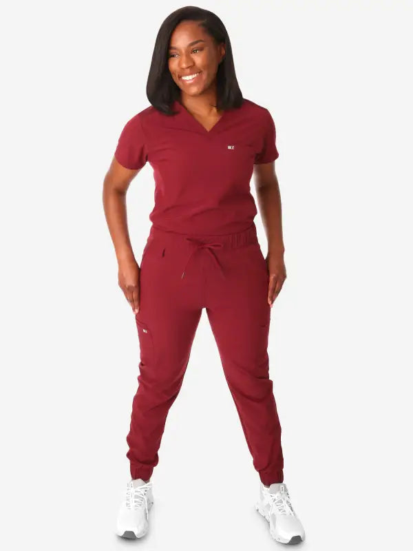 Burgundy Women’s Tuckable One-Pocket Scrub Top with jogger-style pants and v-neck