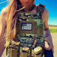 Camo-patterned tactical vest with pouches and flag patch, lightweight Level IV body armor