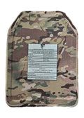Camouflage-patterned ballistic plate with warning label for BIG BOY Crusader 2.0 XL body armor