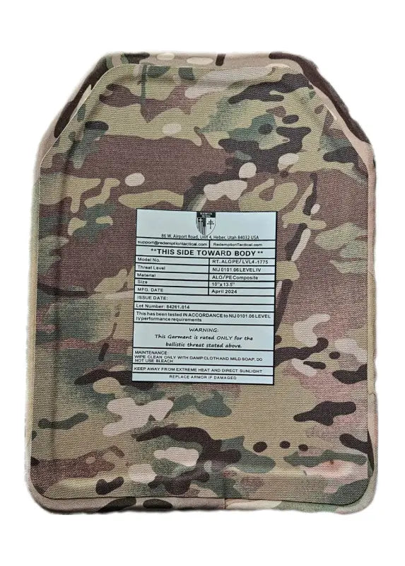 Camouflage-patterned ballistic plate with warning label for BIG BOY Crusader 2.0 XL body armor