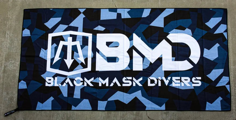 Camouflage patterned beach towel from Tek Towel dive kit for remote dive sites