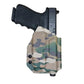 Camouflage-patterned Multimount Holster TLR-7 with black pistol for versatile carry