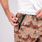 Camouflage patterned carrier training shorts with concealed carry functionality