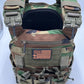 Camouflage tactical body armor with American flag patch from Redemption Tactical, large size