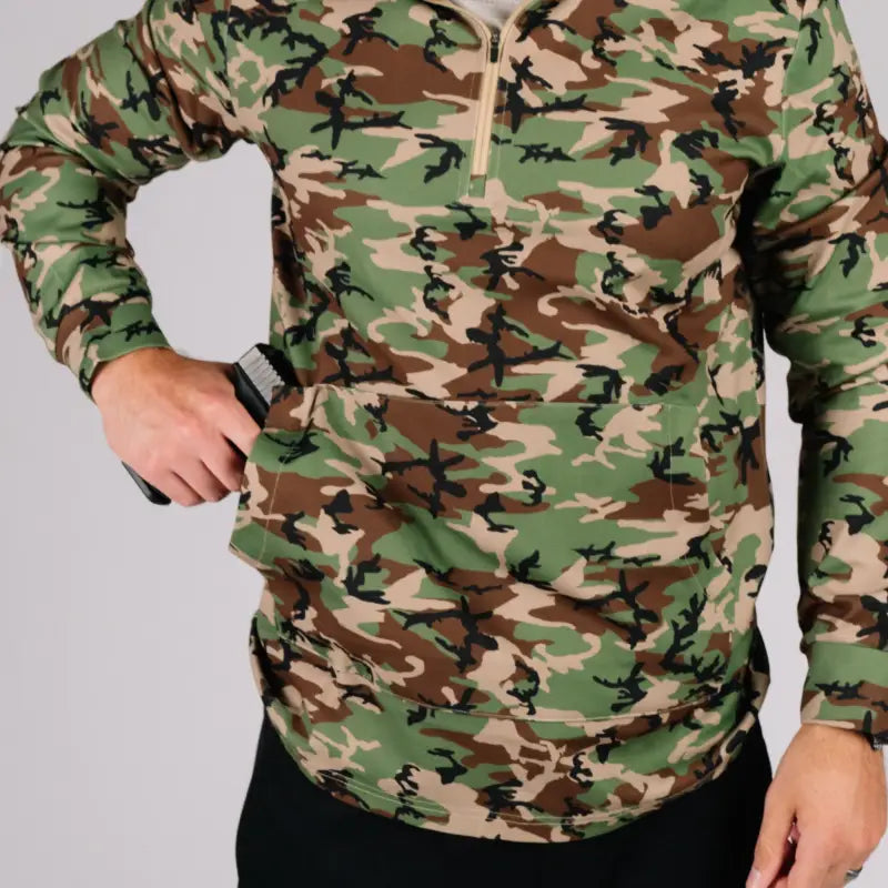 Camouflage pullover with gun pocket showcasing durable quarter zip style for outdoor use