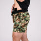 Camouflage carrier training shorts with concealed carry gun tucked in waistband