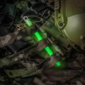 Camouflage tactical gear featuring M-Tac Glow Sticks for enhanced visibility