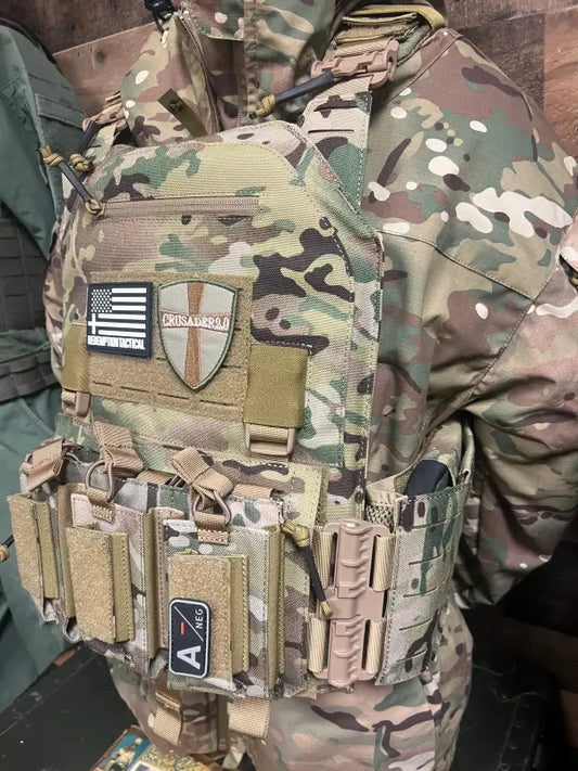 Camouflage tactical vest plate carrier by Redemption Tactical with pouches and patches