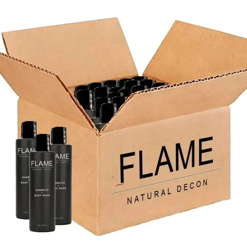 Cardboard shipping box with black bottles of FLAME Natural Decon Shampoo + Body Wash