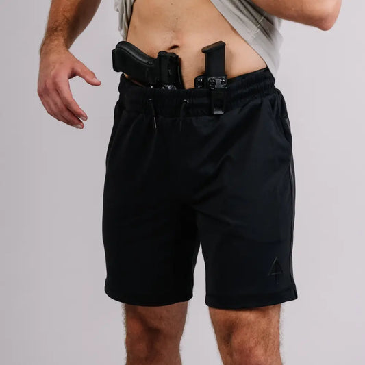 Black athletic shorts featuring patented carrier retention and concealed carry holster