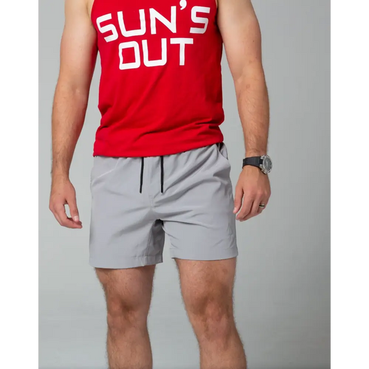 Red tank top with SUN’S OUT text with light gray Carrier Training Shorts for tactical wear