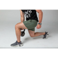 Person demonstrating a lunge in Carrier Training Shorts for concealed carry flexibility