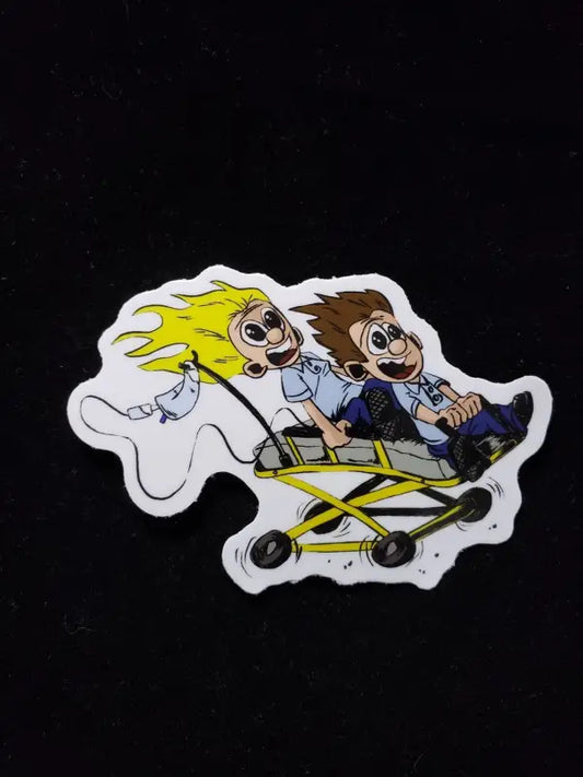 Cartoon sticker of two characters in a yellow stroller for EMT Stretcher Ride fun