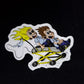 Cartoon sticker of EMS First Responders in a yellow go-kart racing crazily