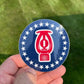 Circular blue Barsprink Sticker with red lantern icon and white stars for first responders