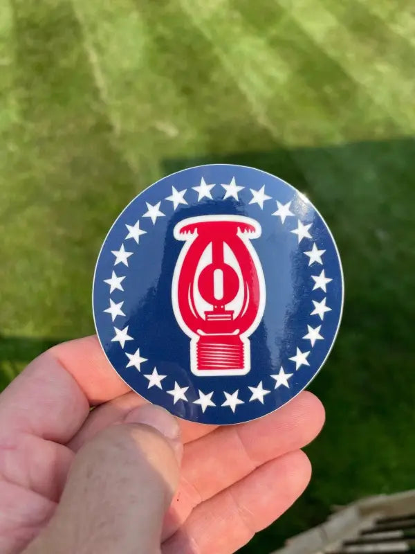 Circular blue Barsprink Sticker with red lantern icon and white stars for first responders