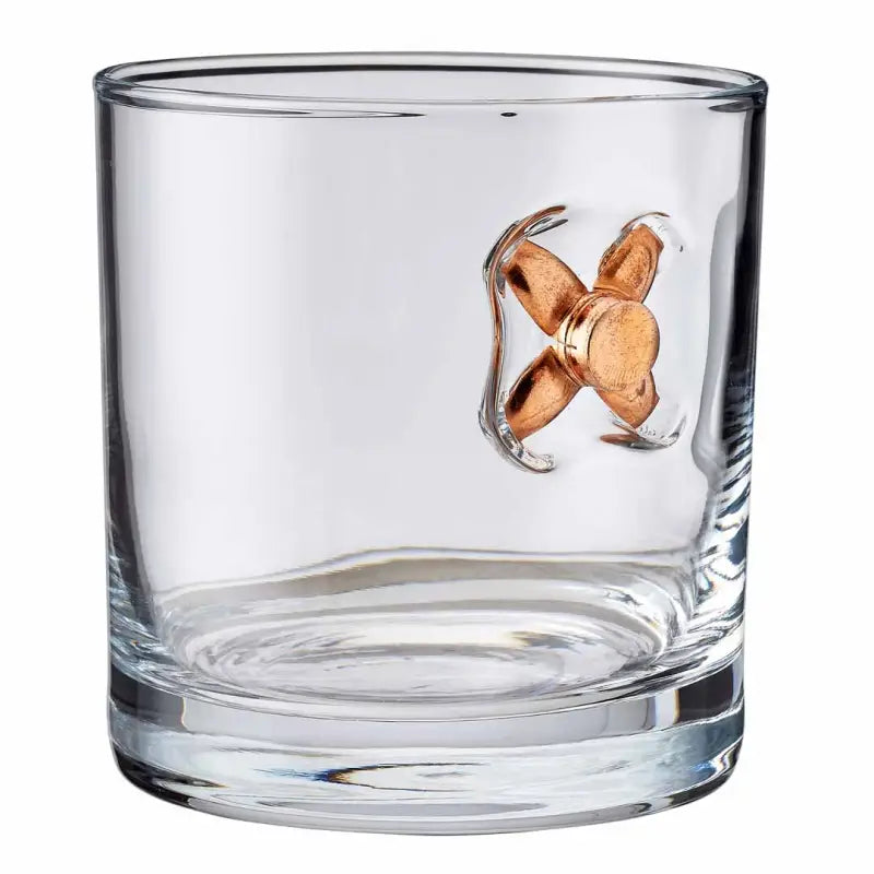 Clear glass tumbler with a copper bullet in BenShot Rocks Glass - 11oz