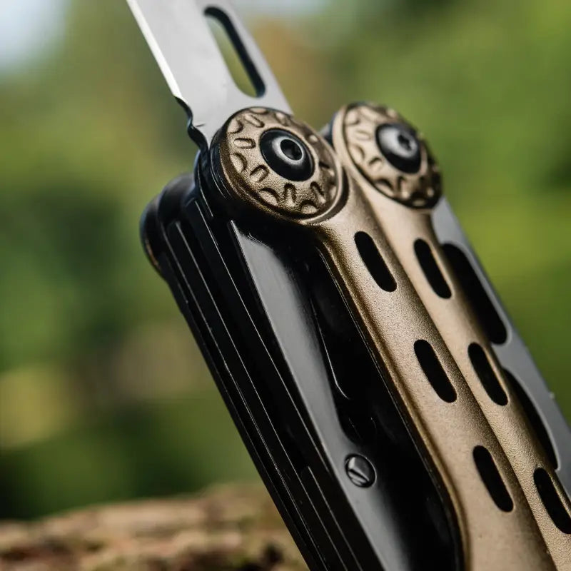 Close-up of M-Tac Multitool Type 5 Olive folding knife with decorative pivot screws