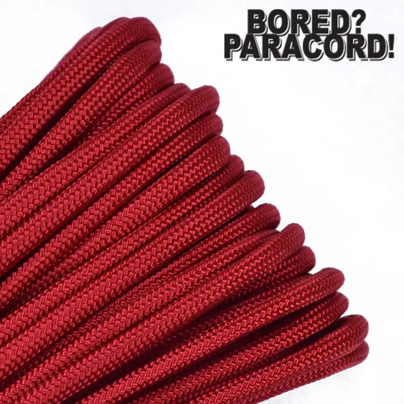 Coiled Red Paracord Rope showcasing Bored Paracord Brand’s braided nylon texture