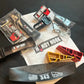 Collection of BMX bike parts, stickers, Handy Hook Combo, Rascal Wedges, and Helmet Band