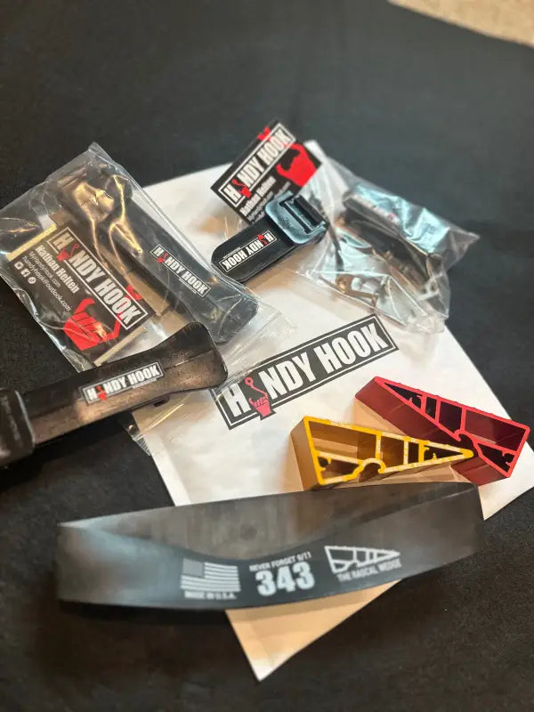 Collection of BMX bike parts, stickers, Handy Hook Combo, Rascal Wedges, and Helmet Band