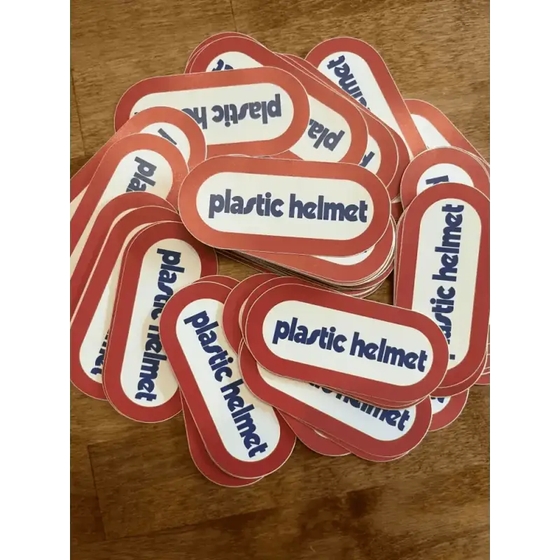 Collection of red and white stickers labeled plastic helmet for first responders and firefighters