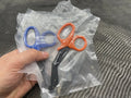 Two pairs of Compact Trauma Shears Gen 3 by Maratac in blue and orange handles